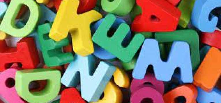 Colourful letter blocks in a pile