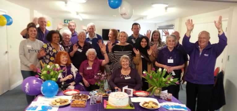 The group celebrating Make May Purple