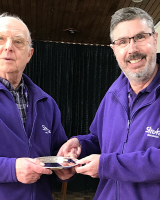 David Mussel receiving the David O'Rouke Award from another man.