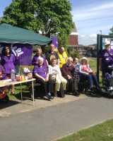 Photo of group taking part at a Make May Purple event